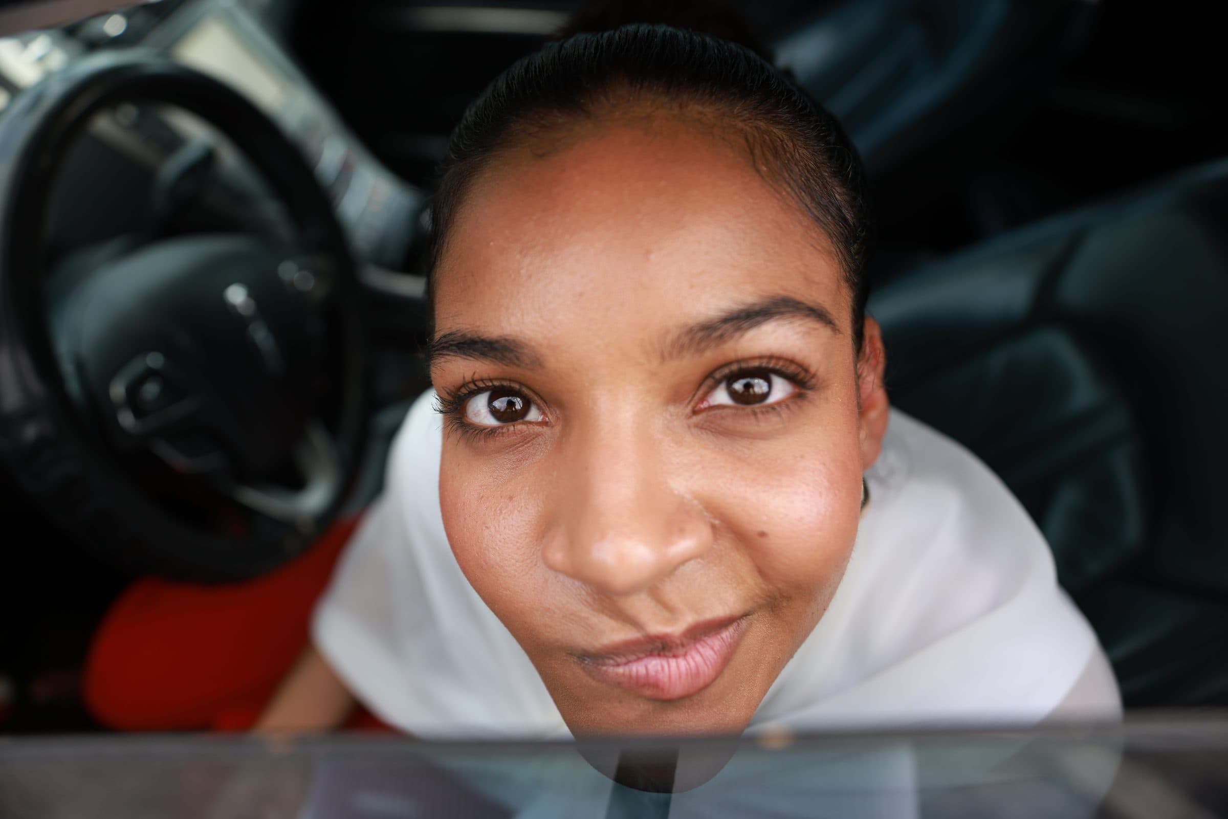 A close-up of Alexia smiling up at the camera